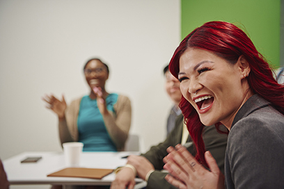 Young woman with red hair laughing