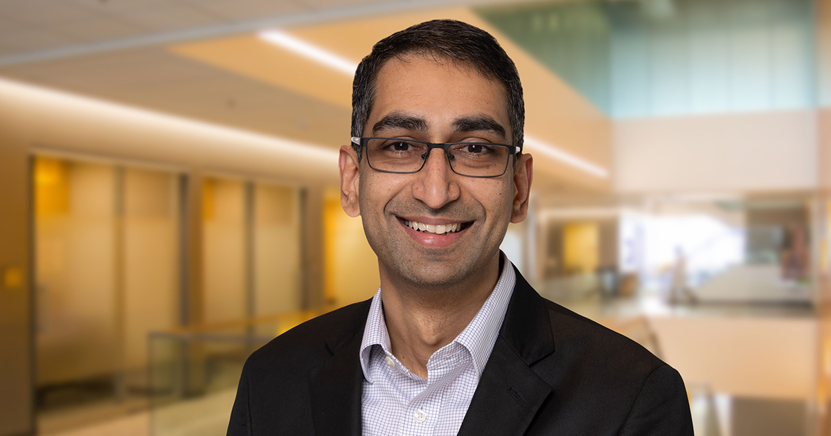 BMS Drug Development leader, Nataraj Kalyanaraman, in a dark blazer and wearing glasses