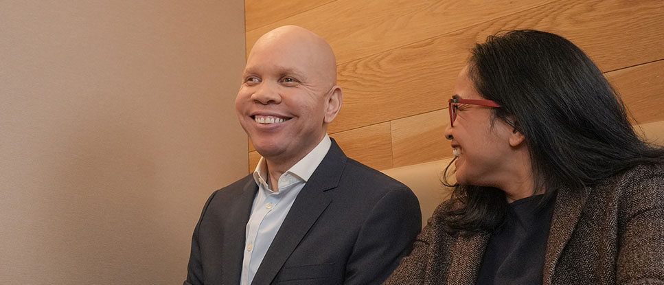 photo of two employees laughing