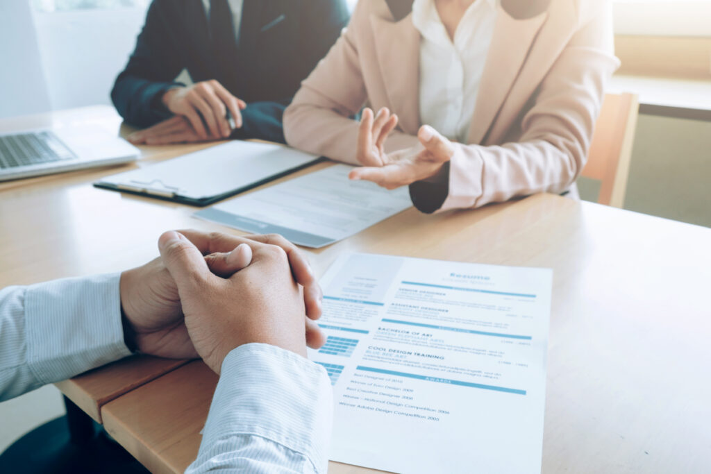 Candidate with resume being interviewed